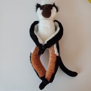 Plush Monkey Toy in Black, White, and Brown